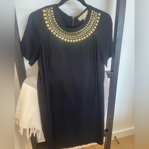 Michael Kors small black dress with gold embellishments on the neckline